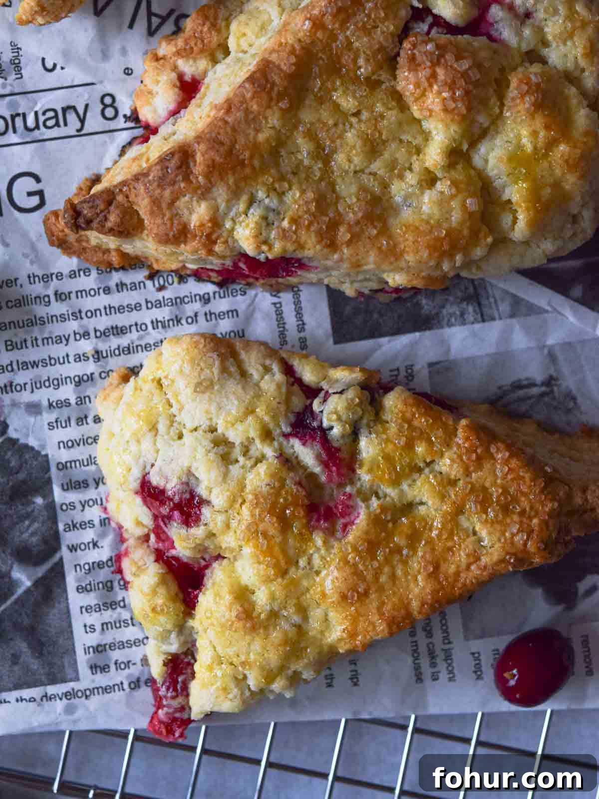 Tender Cranberry Orange Cream Scones Recipe 4 Overhead view of cranberry orange scones on a wire rack.