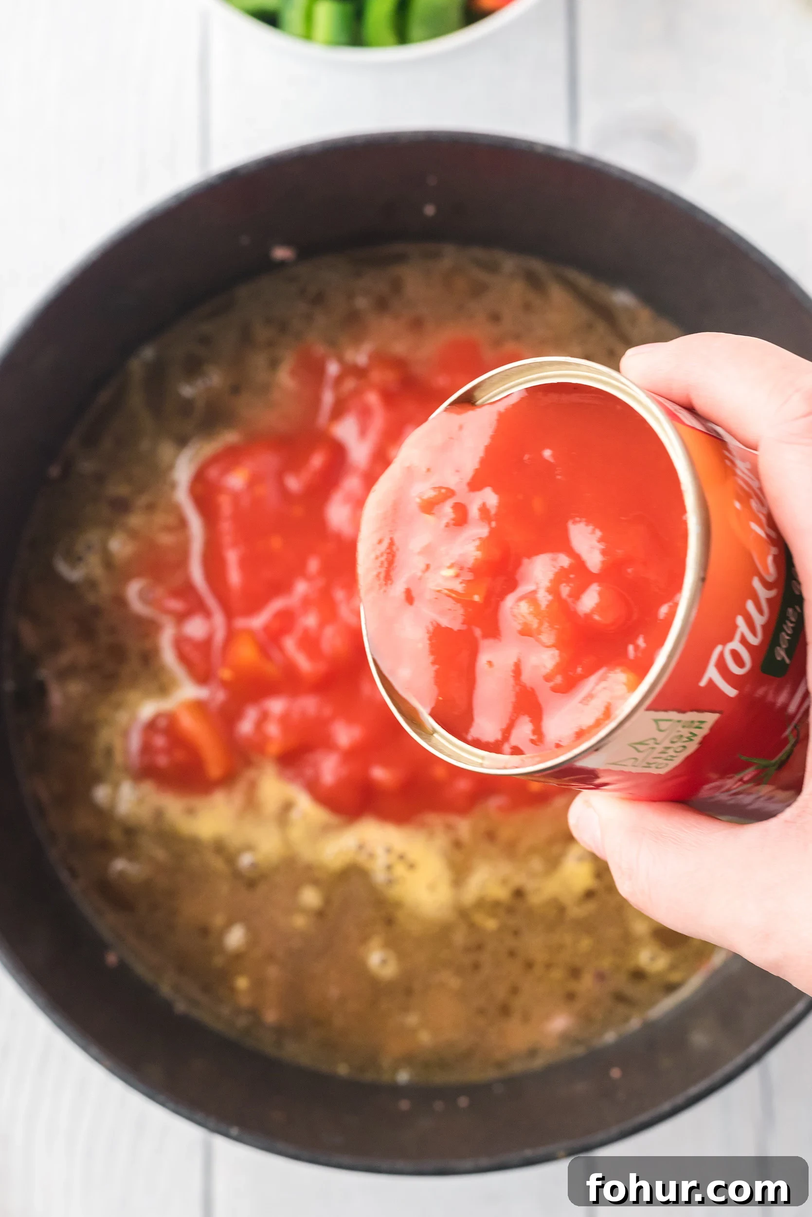Stuffed Pepper Soup Recipe That Warms the Soul 4 diced tomatoes and their liquid being added to the Dutch oven