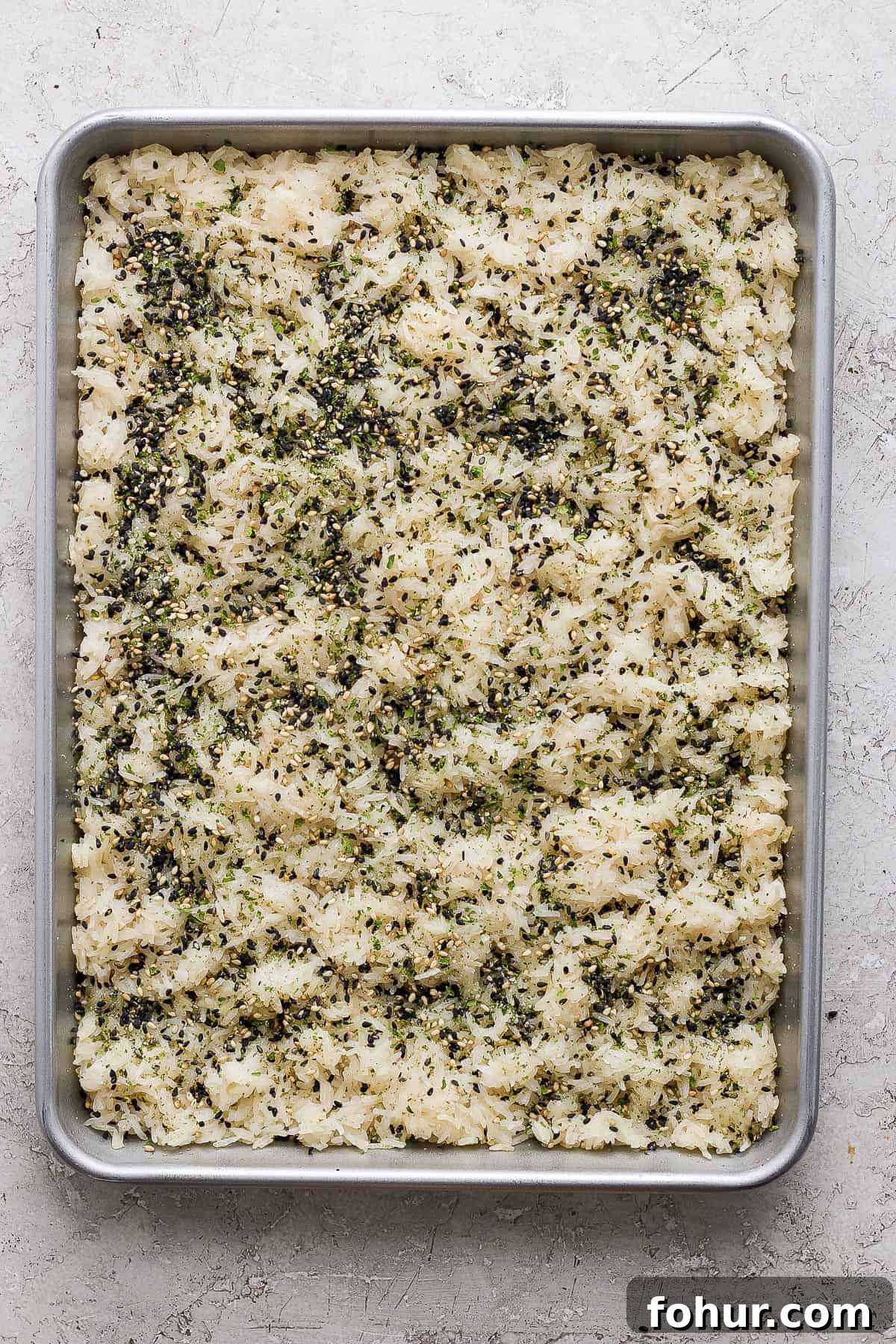 Sushi Bake Recipe: Creamy Baked Sushi Casserole 4 Baked sticky rice with furikake sprinkled on top.