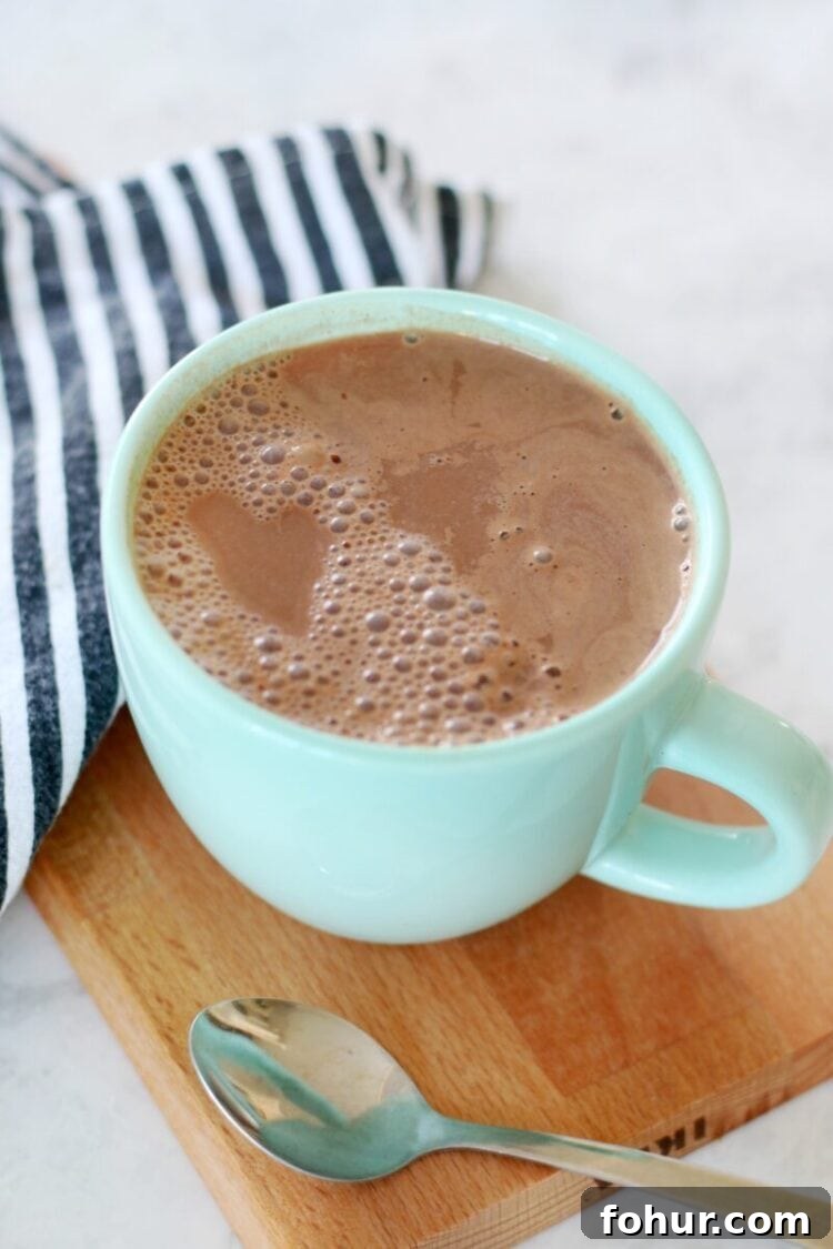 How to Make 108-Calorie Hot Cocoa (Video) 2 hot cocoa mug on cutting board