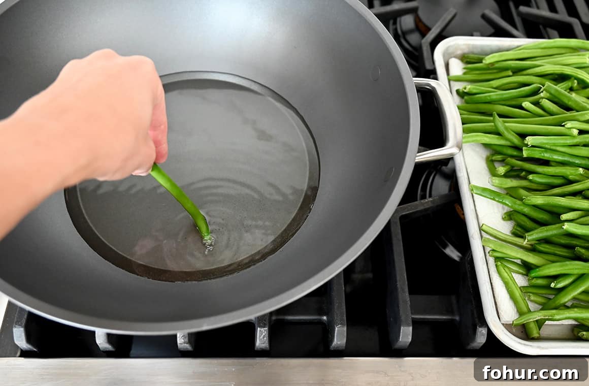 Stir-Fried Chinese Garlic Green Beans 2 Hot oil in a wok