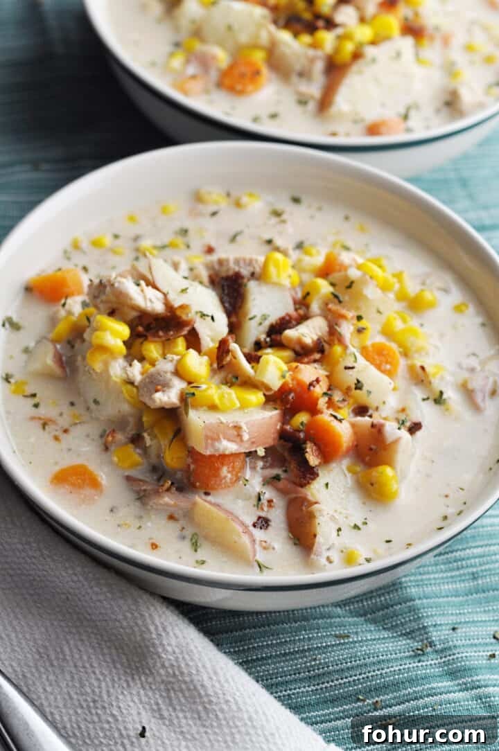 Slow Cooker Chicken and Corn Soup Recipe 4 Corn soup with chicken, potatoes, and carrots in bowl