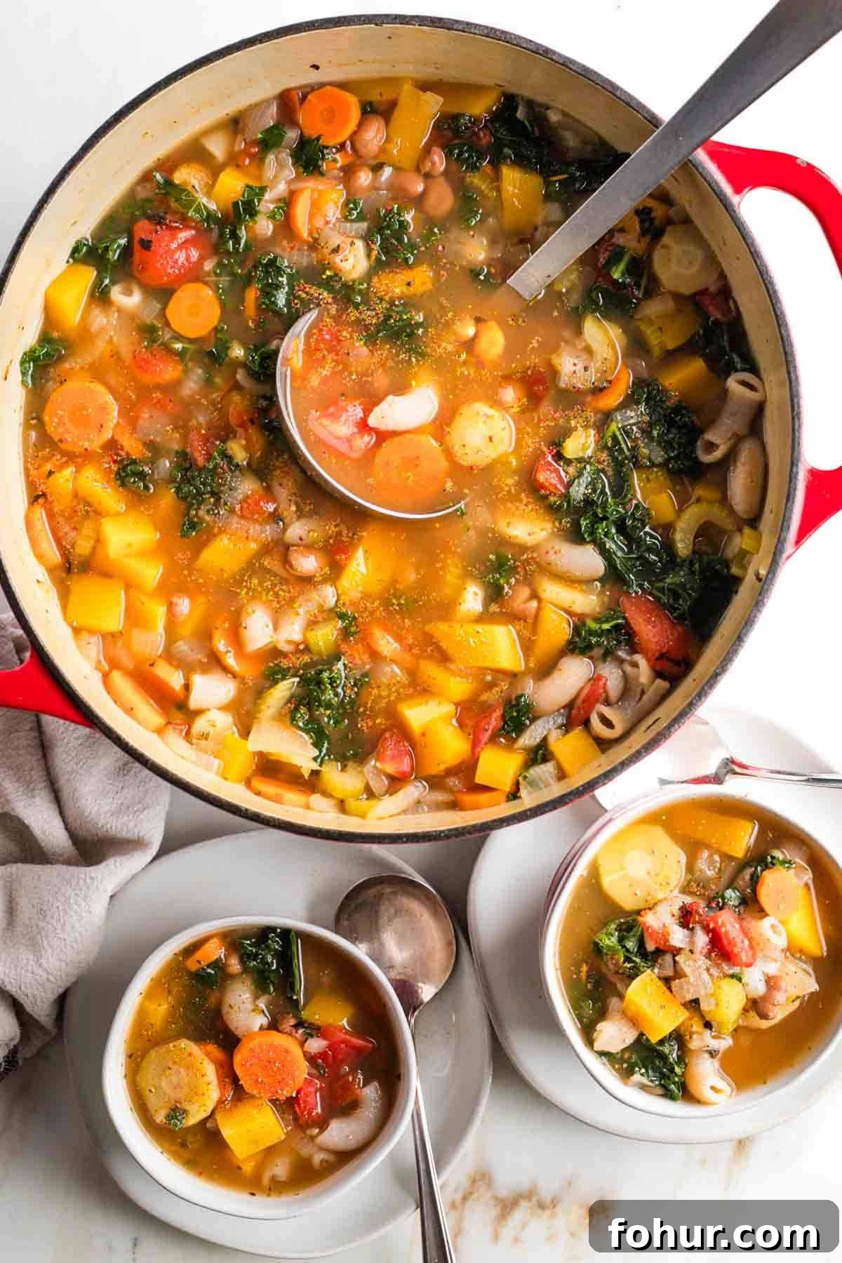 Vegan Fall Minestrone Soup with Roasted Autumn Vegetables 2 Chunks of veggies, beans and pasta in a deep rich broth.