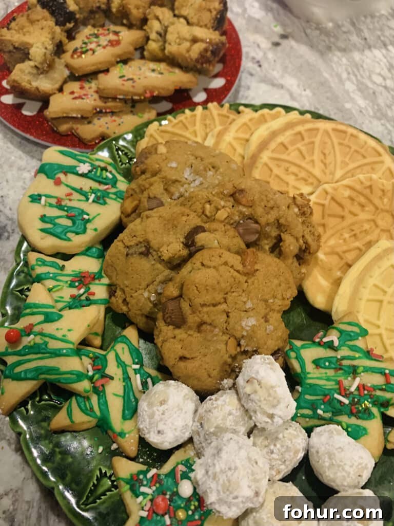 Chocolate Chip Cookies with Peanut Butter Cups, Sea Salt and Nuts 2 Assorted Christmas cookie platter, containing Buttery Pecan Snowball Cookies, Anise Pizzelles and Peanut Butter Cup Chocolate Chip Cookies.
