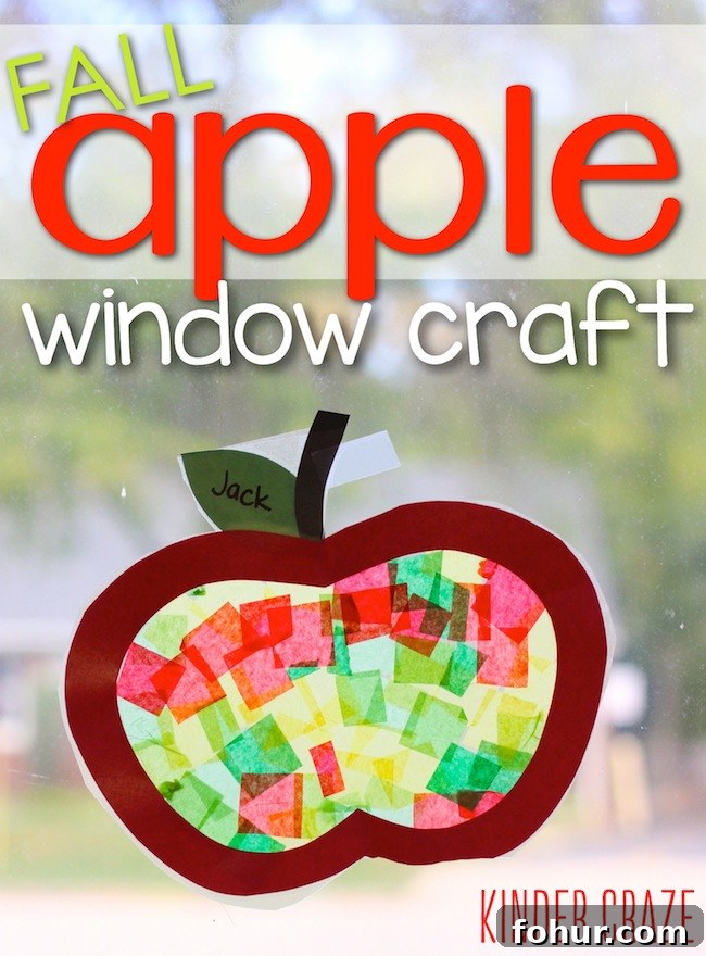apple craft with tissue paper hanging on a window
