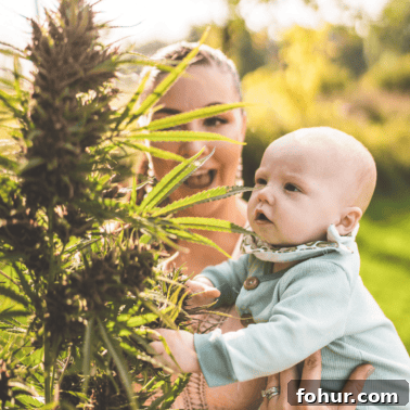Coming Out About Cannabis: My Personal Story 7 A picture of Emily Kyle and her baby with a cannabis plant.