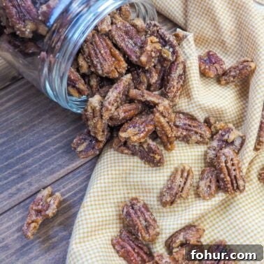 Creamy Southern Broccoli Casserole Recipe 10 a spilled jar of candied pecans on a white and yellow napkin.