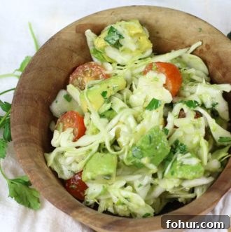 Avocado Cabbage Slaw - Enjoy this as a side salad next to a healthy protein or add some to your favorite tacos. It's rich in healthy fats, yummy crunch and loads of flavor. #lowcarb #paleo #whole30