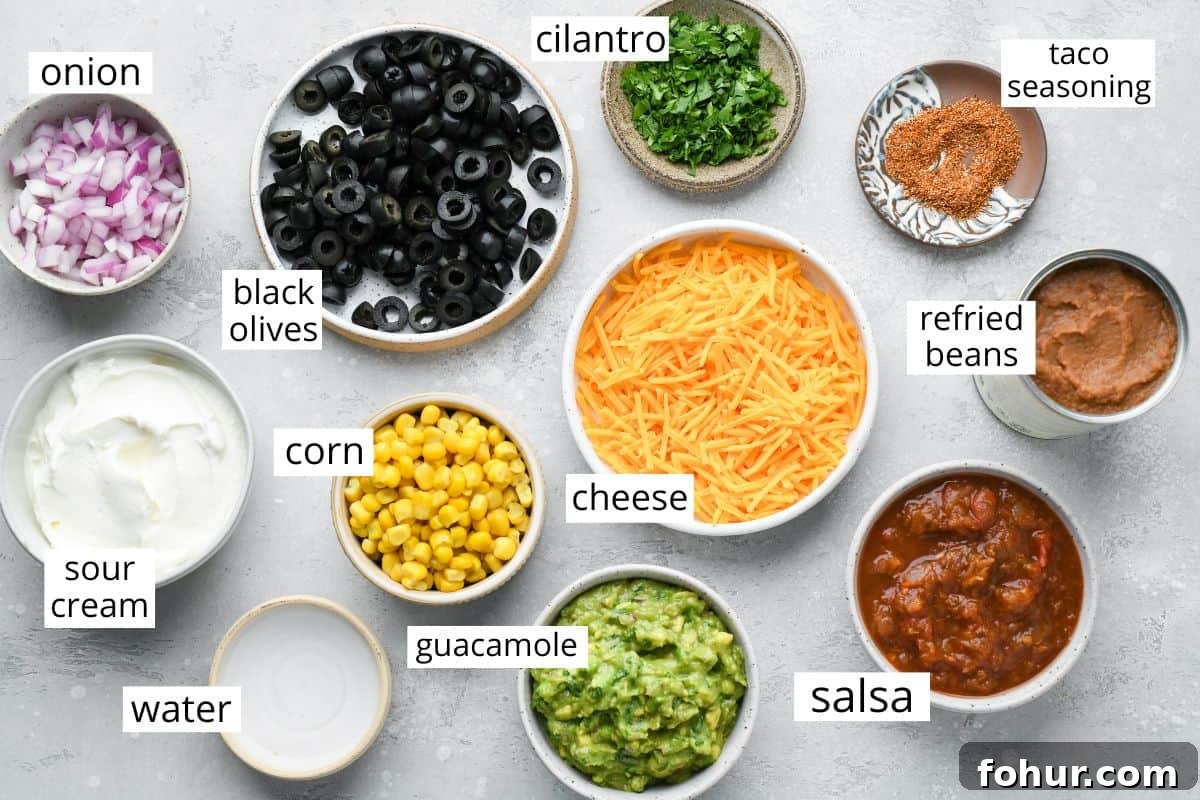 Authentic Mexican Seven Layer Dip Recipe 3 overhead photo of the ingredients in this Mexican 7 Layer Dip recipe