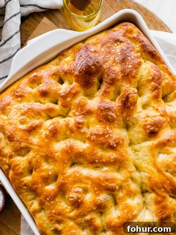 Oven Baked Italian Sausage Recipe with Peppers and Onions 10 no-knead focaccia in a pan after it is done baking.