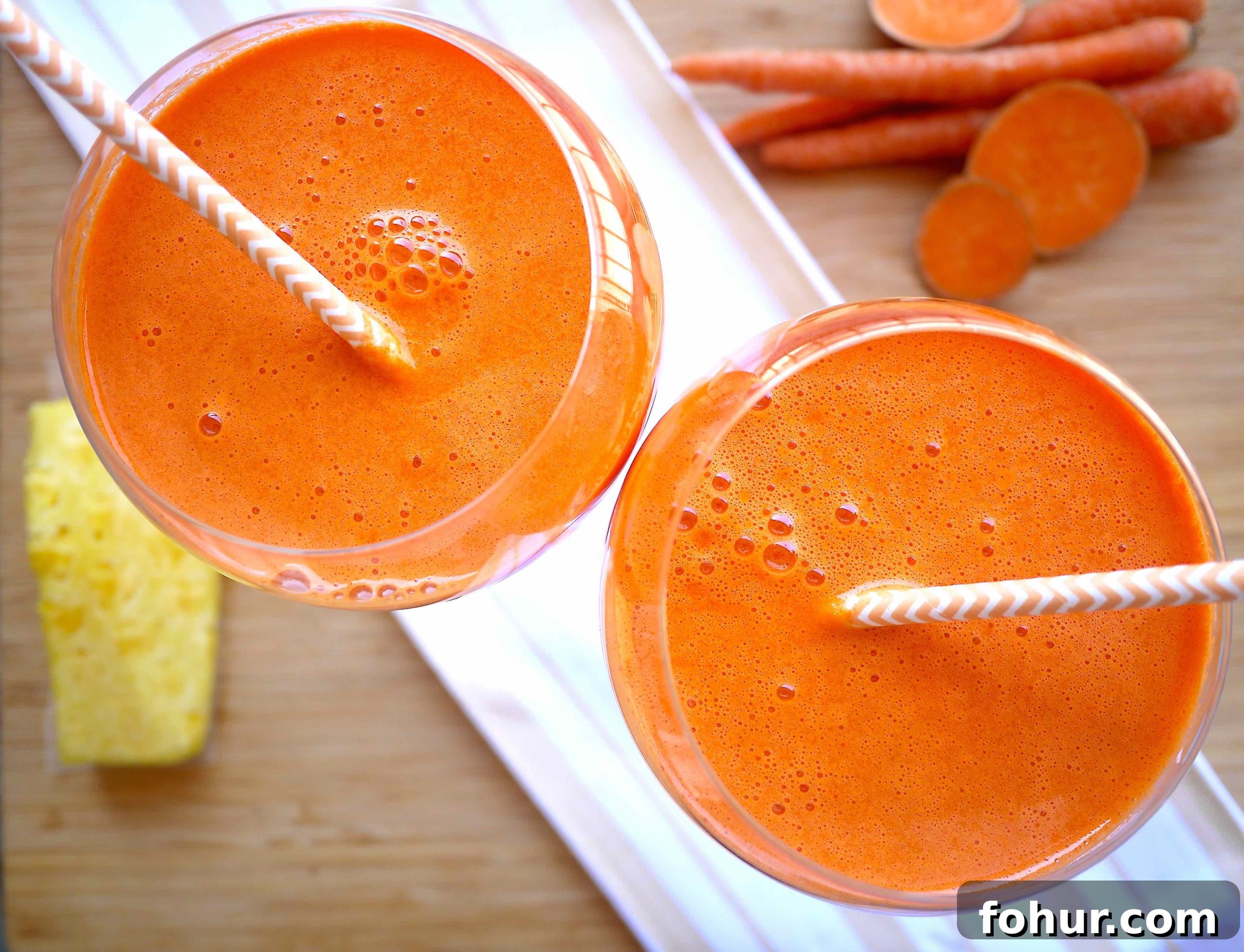 Carrot, Mango & Sweet Potato Juice Rich in Beta-Carotene 3 Mango carrot juice in two glasses.