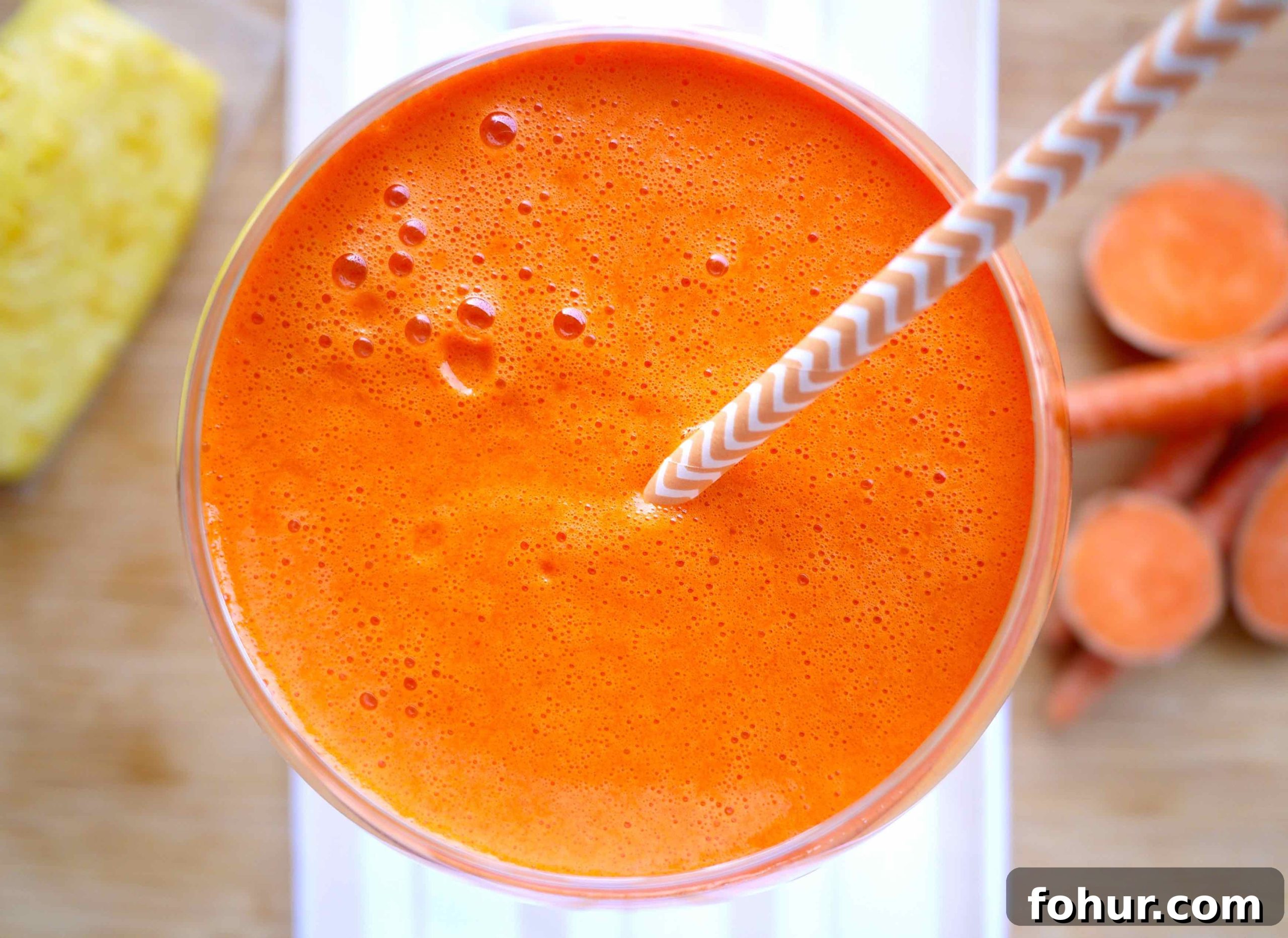 Carrot, Mango & Sweet Potato Juice Rich in Beta-Carotene 4 Sweet potato, mango, carrot, pineapple juice in a glass.