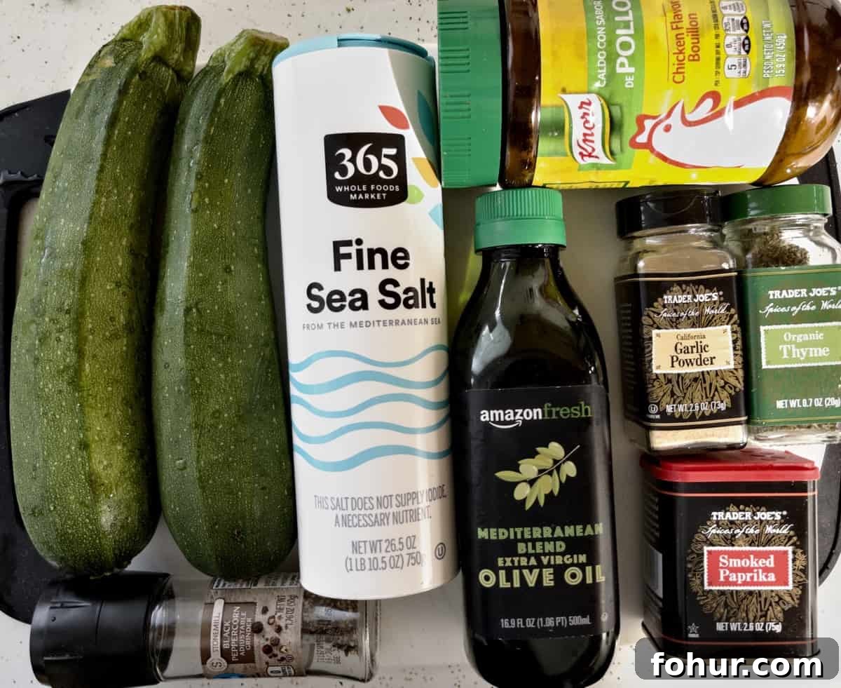 Crispy Air Fryer Zucchini Recipe 3 ingredients for air fryer zucchini spread out on cutting board
