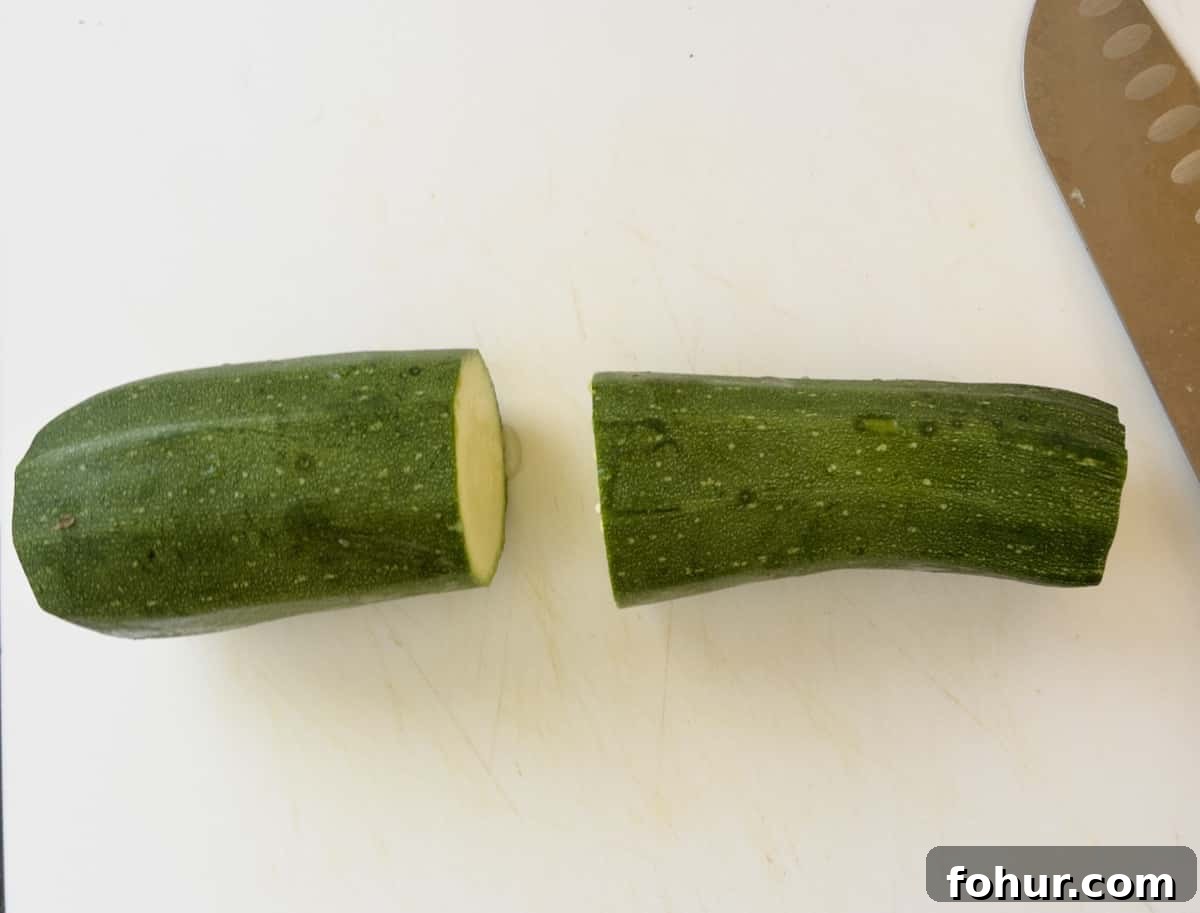 Crispy Air Fryer Zucchini Recipe 4 zucchini cut in half step 1