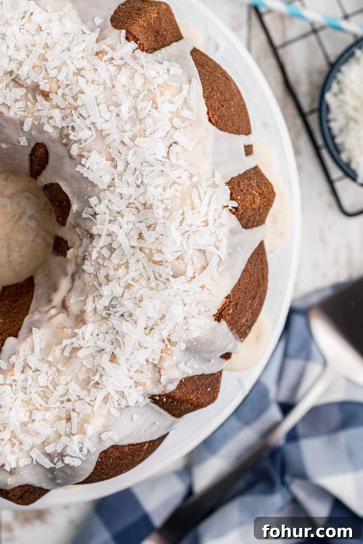 Classic Louisiana Crunch Cake Recipe with Praline Topping 2 close up of a louisiana crunch cake with icing and coconut on top