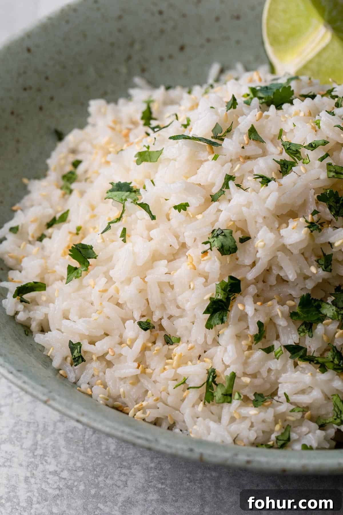 Instant Pot Coconut Jasmine Rice Recipe 5 bowl of rice with lime wedge