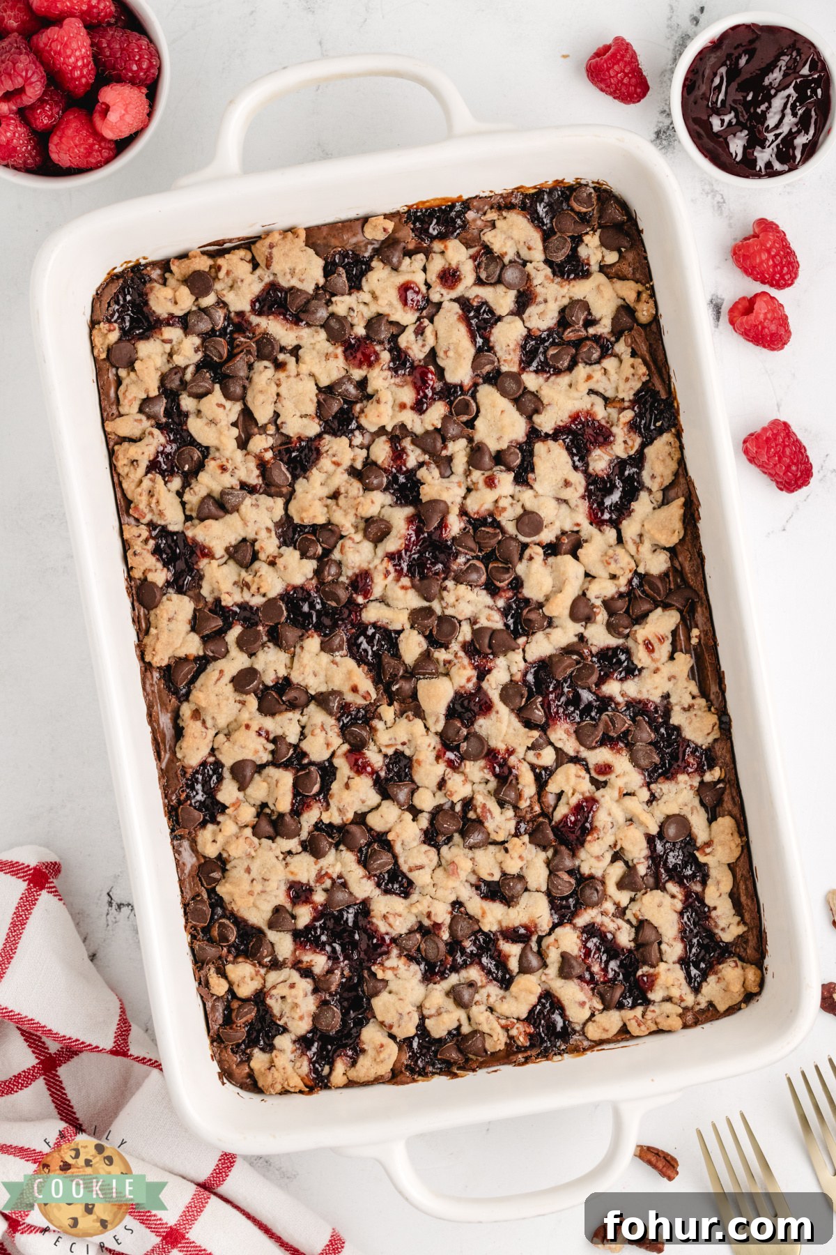 Decadent Chocolate Raspberry Shortbread Cookie Bars Recipe 4 Chocolate raspberry shortbread cookie bars in a 9x13 pan with crumb topping.