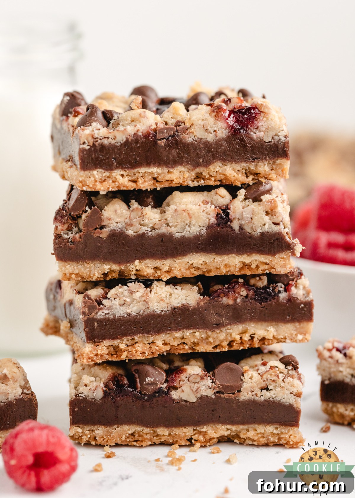 Decadent Chocolate Raspberry Shortbread Cookie Bars Recipe 7 Stack of chocolate raspberry shortbread bars showing layers of crust and crumb topping.