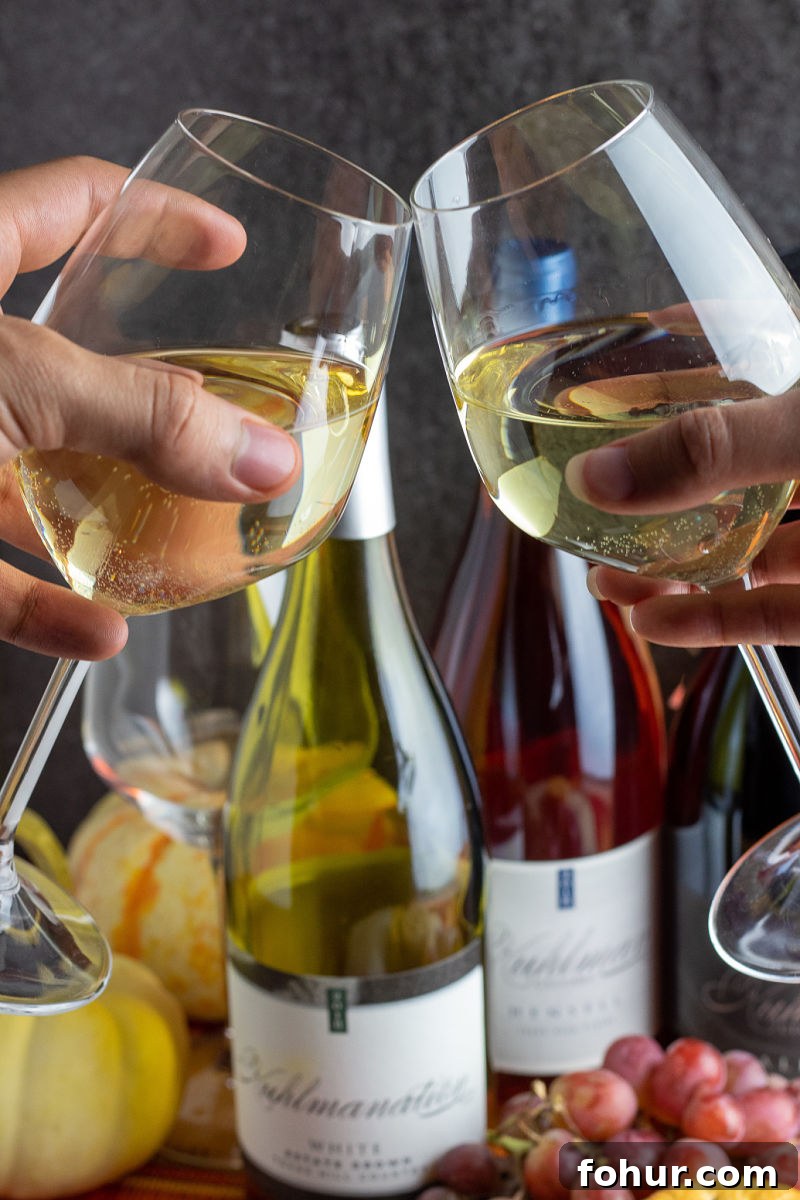 Cheers with Kuhlman Cellars White Estate Wine in glasses