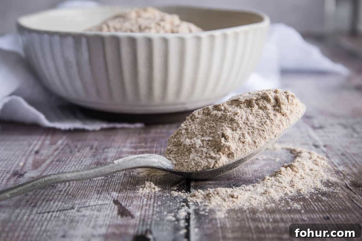 How to Bake with Gluten-Free Flours: Tips and Techniques 9 spoon of green banana flour in front of a bowl