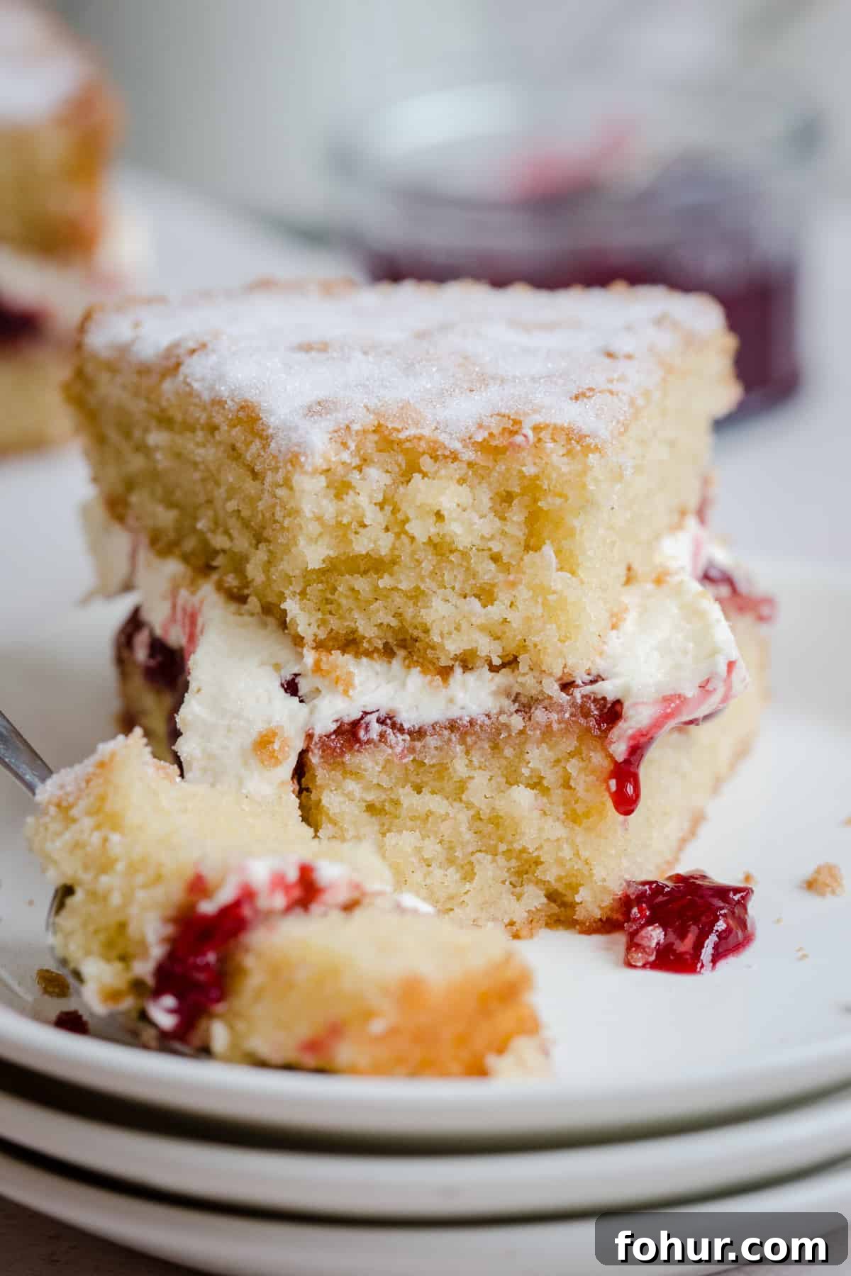 How to Bake with Gluten-Free Flours: Tips and Techniques 4 slice of victoria sponge with bite taken out on plate