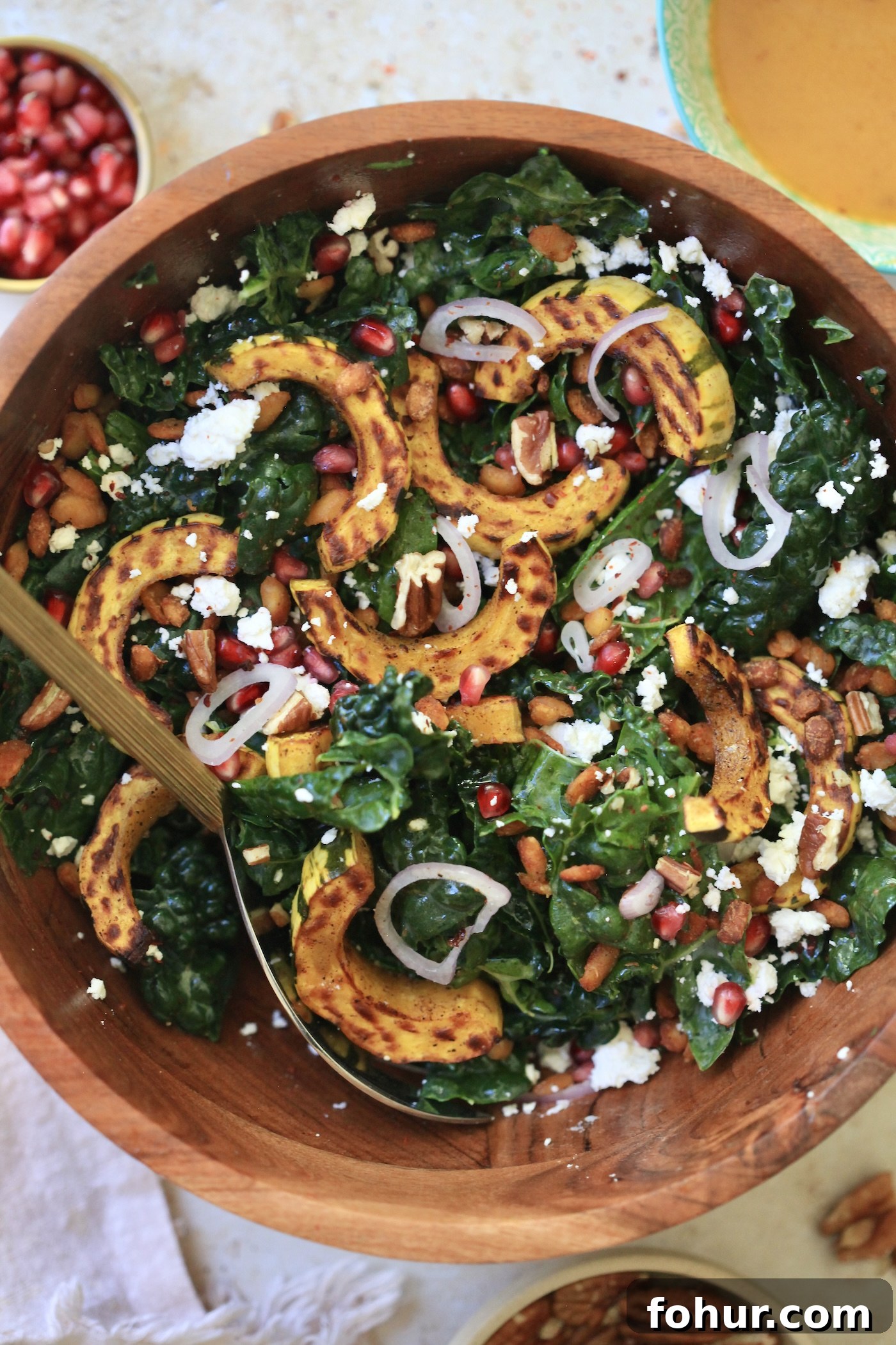 kale salad with squash in bowl