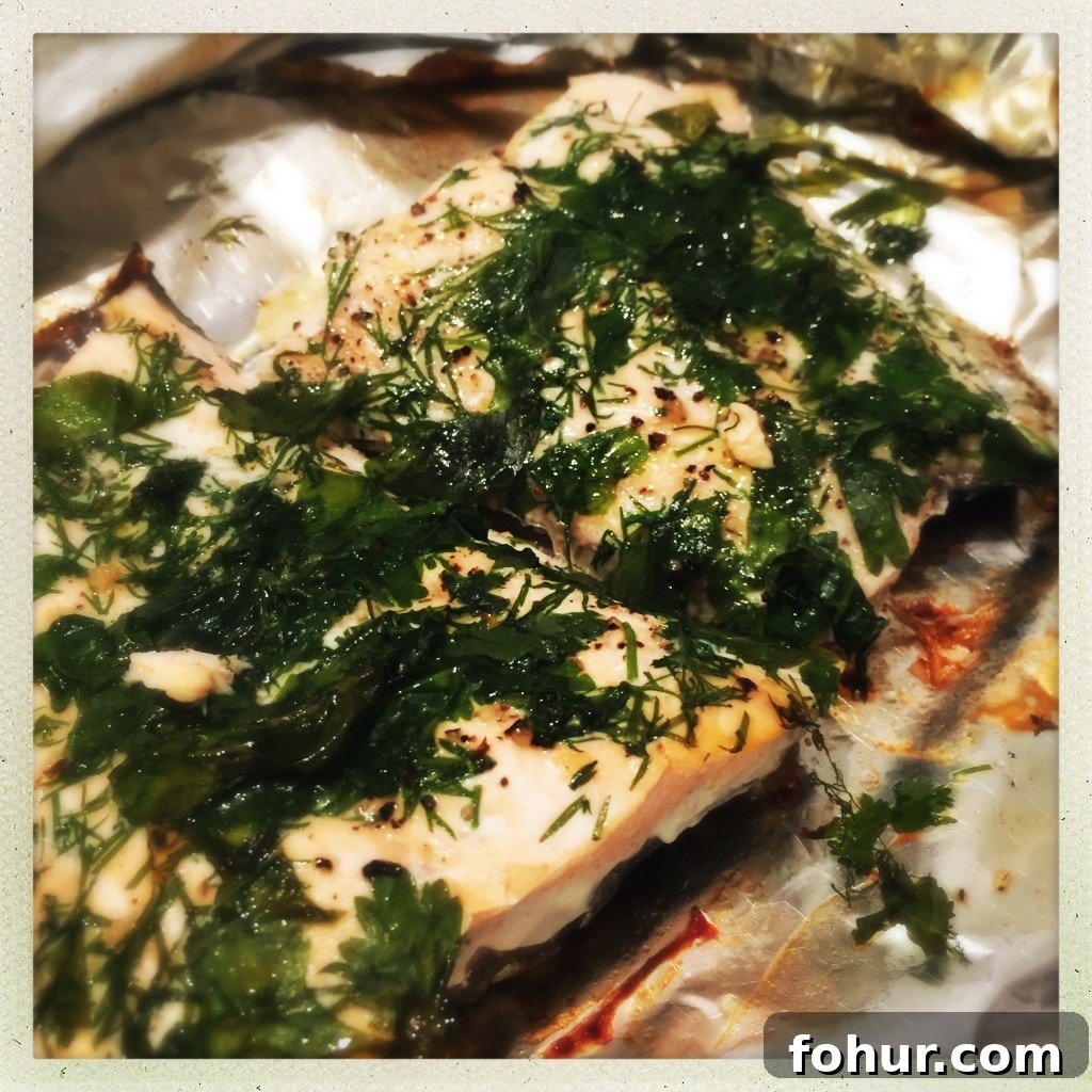 Baked Herbed Salmon Parcels with Lemon and Dill 2 Oven baked salmon in foil parcel with fresh herbs