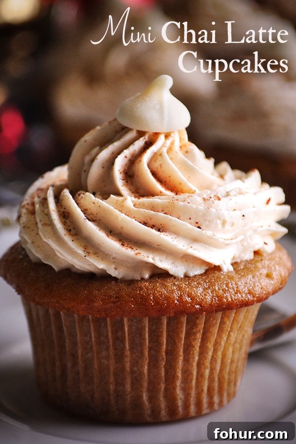 Mini Chai-Spiced Cupcakes with Italian Meringue Buttercream 2 A mini chai cupcake with Italian meringue buttercream on a plate.