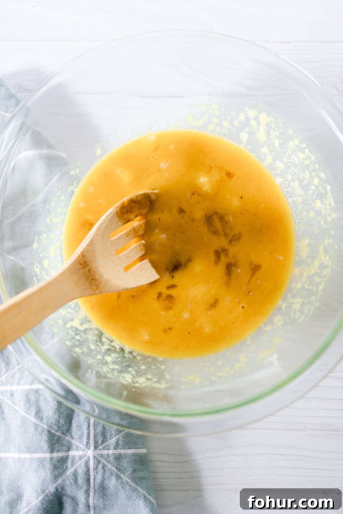 Moist Gluten-Free Zucchini Bread Recipe 5 Stirring the wet ingredients together in a glass bowl.