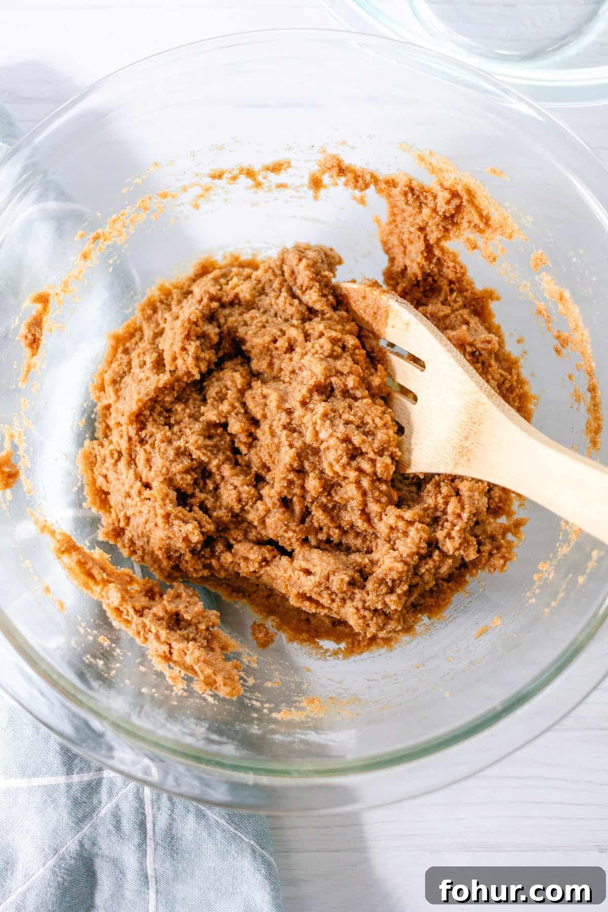 Moist Gluten-Free Zucchini Bread Recipe 6 Mixing the batter together in glass bowl with a wooden spoon.