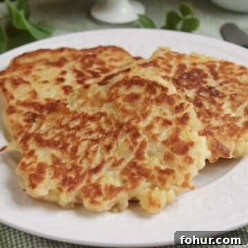 12 St. Patrick's Day Recipes to Make This Year 13 Three Irish pancakes on a plate with a fork on the side