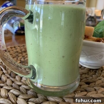 12 St. Patrick's Day Recipes to Make This Year 14 Smoothie in a large glass cup.