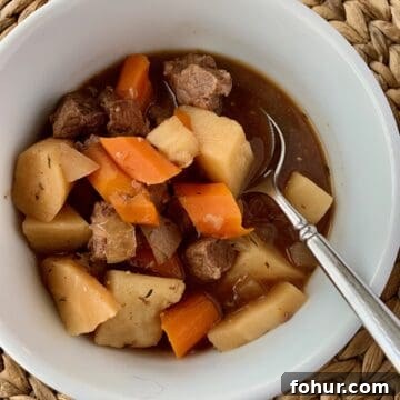 12 St. Patrick's Day Recipes to Make This Year 3 Irish stew in a small bowl with a spoon.