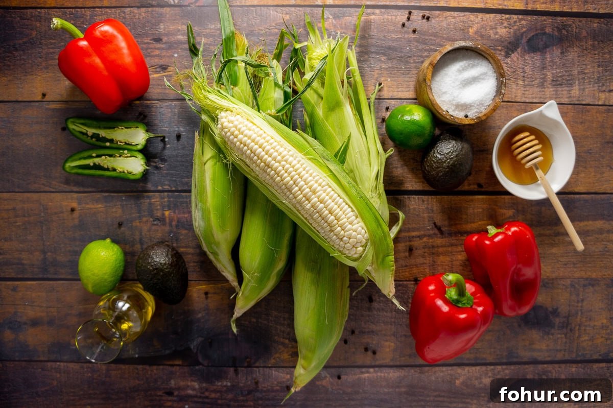 Ingredients for making an avocado corn salad with roasted red peppers and lime dressing