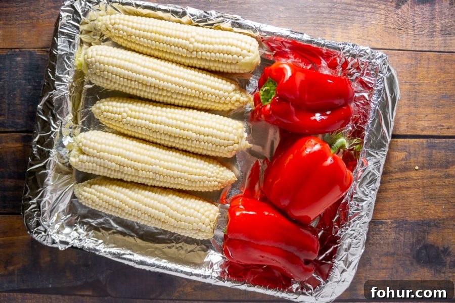 corn and red peppers on a pan