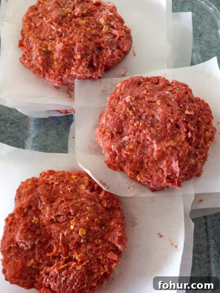 Amish-Style Grilled Burgers: Classic BBQ Recipe 5 hamburgers with parchment paper between them