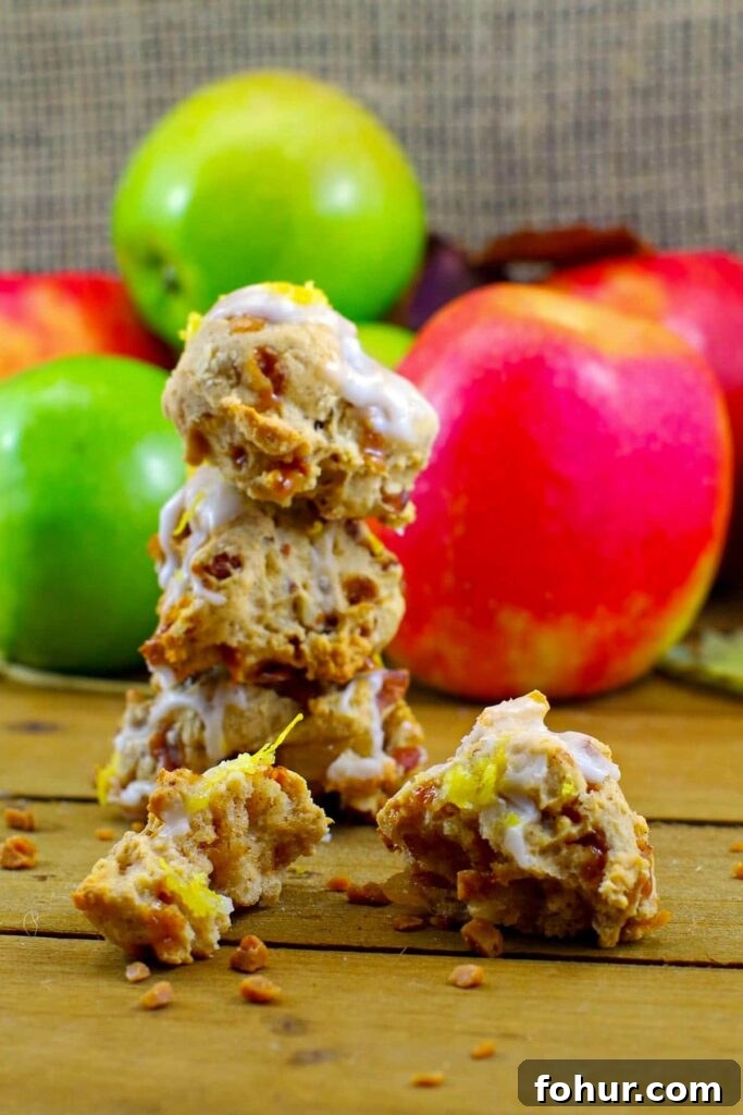 award-winning apple pie cookies stacked with apples in background