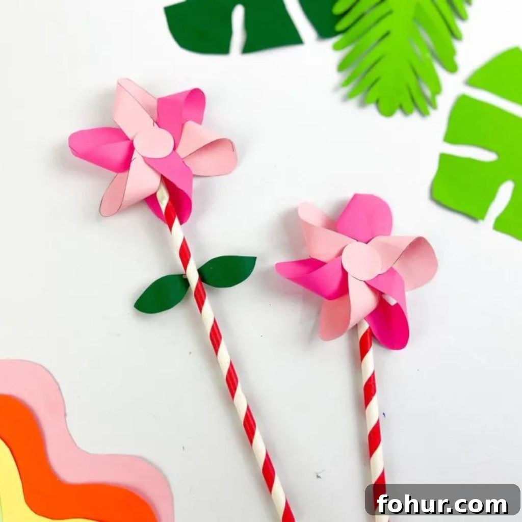 16 Paper Flower Crafts to Make This Spring 2 PINK SPRING FLOWER WITH LEAVES