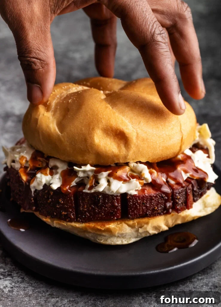 How to Smoke Bologna for Tender, Smoky Flavor 3 smoked bologna sandwich with cole slaw and bbq sauce