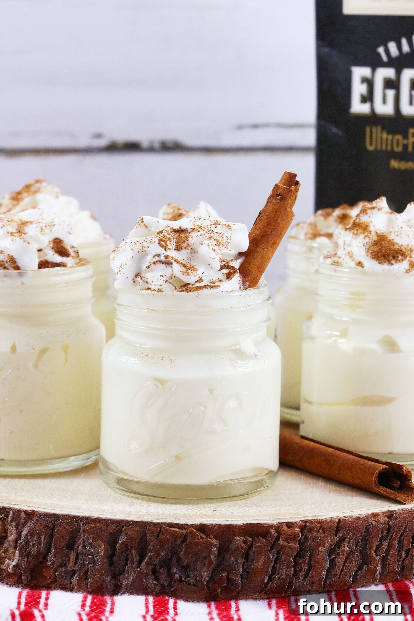 Creamy Eggnog Pudding Shots for Holiday Parties 2 group of eggnog pudding shots on a wooden platter