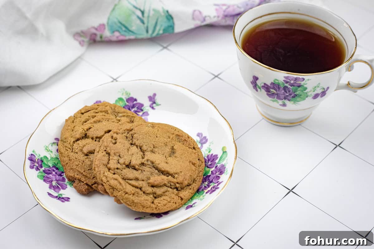 19 Cookie Recipes Even Dessert Skeptics Can't Resist 18 A plate of Spiced Ginger Cookies and a cup of tea.
