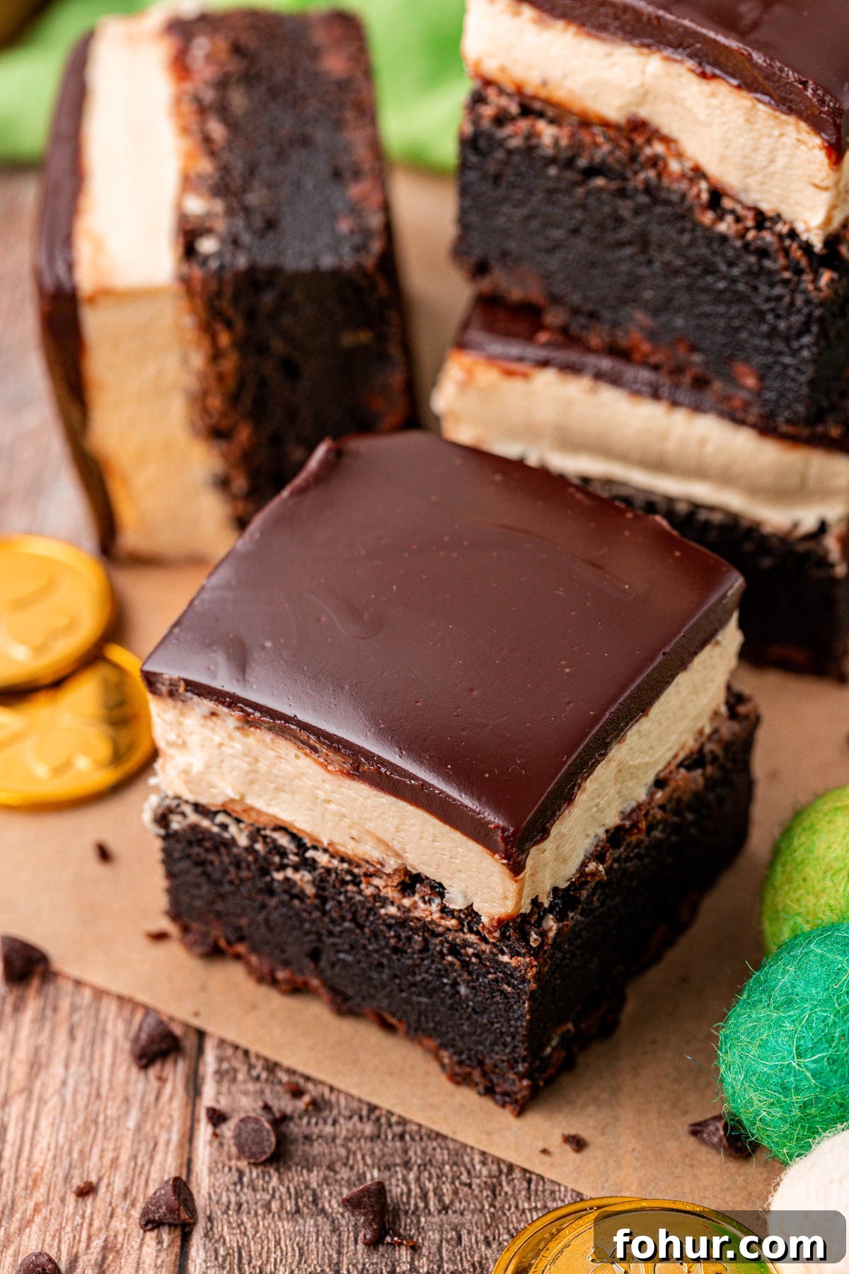 Decadent Baileys Irish Cream Brownies Recipe 6 Close up of a brownie with Bailey's frosting and ganache on top.